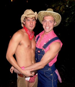 Two cute young men dressed as farm hands.
