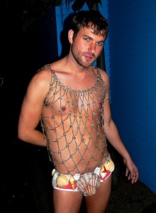 Attractive young man dressed as a merman.