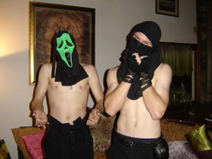 Shirtless young guys in costumes.