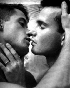 Two young men kissing